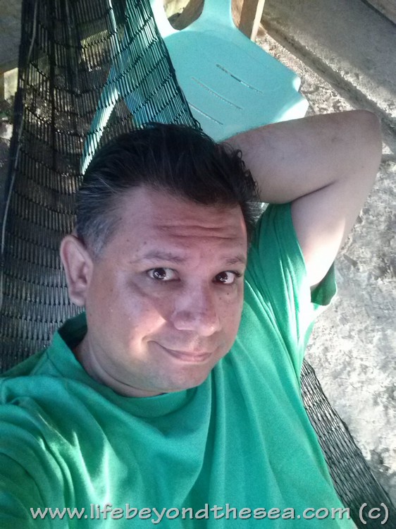 Me in the fish-net hammock on my front patio.