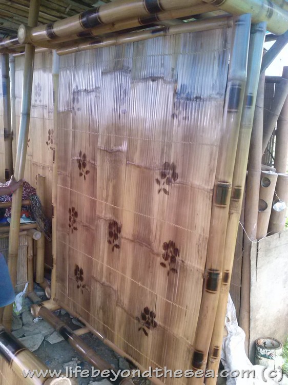 Picking out my new bed in town. Handmade bamboo, really strong.  Only $34 USD!